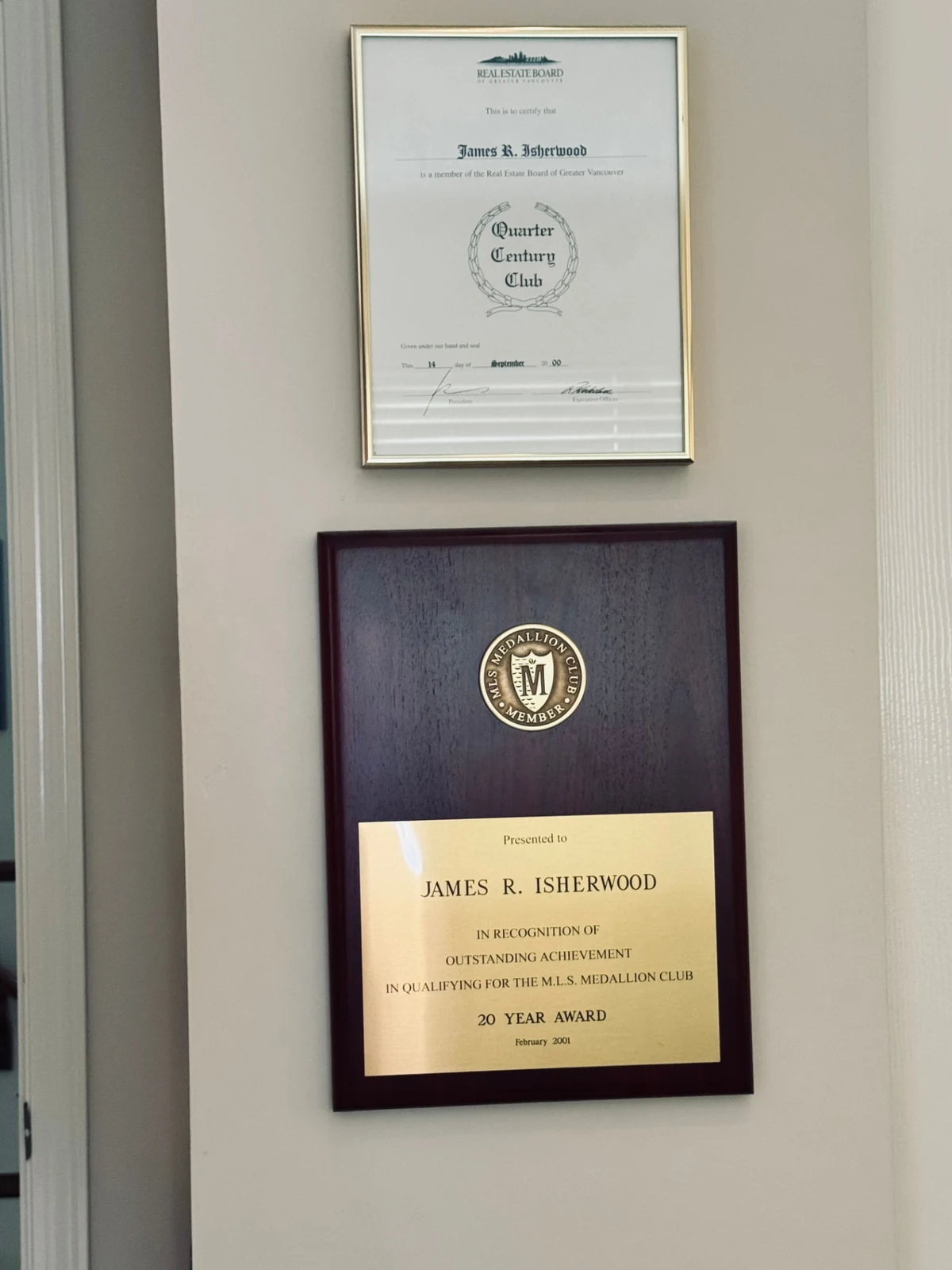James R. Isherwood’s Real Estate Board of Greater Vancouver Quarter Century Club certificate dated September 14, 2000 above his 20-Year MLS Medallion Award dated February 2001