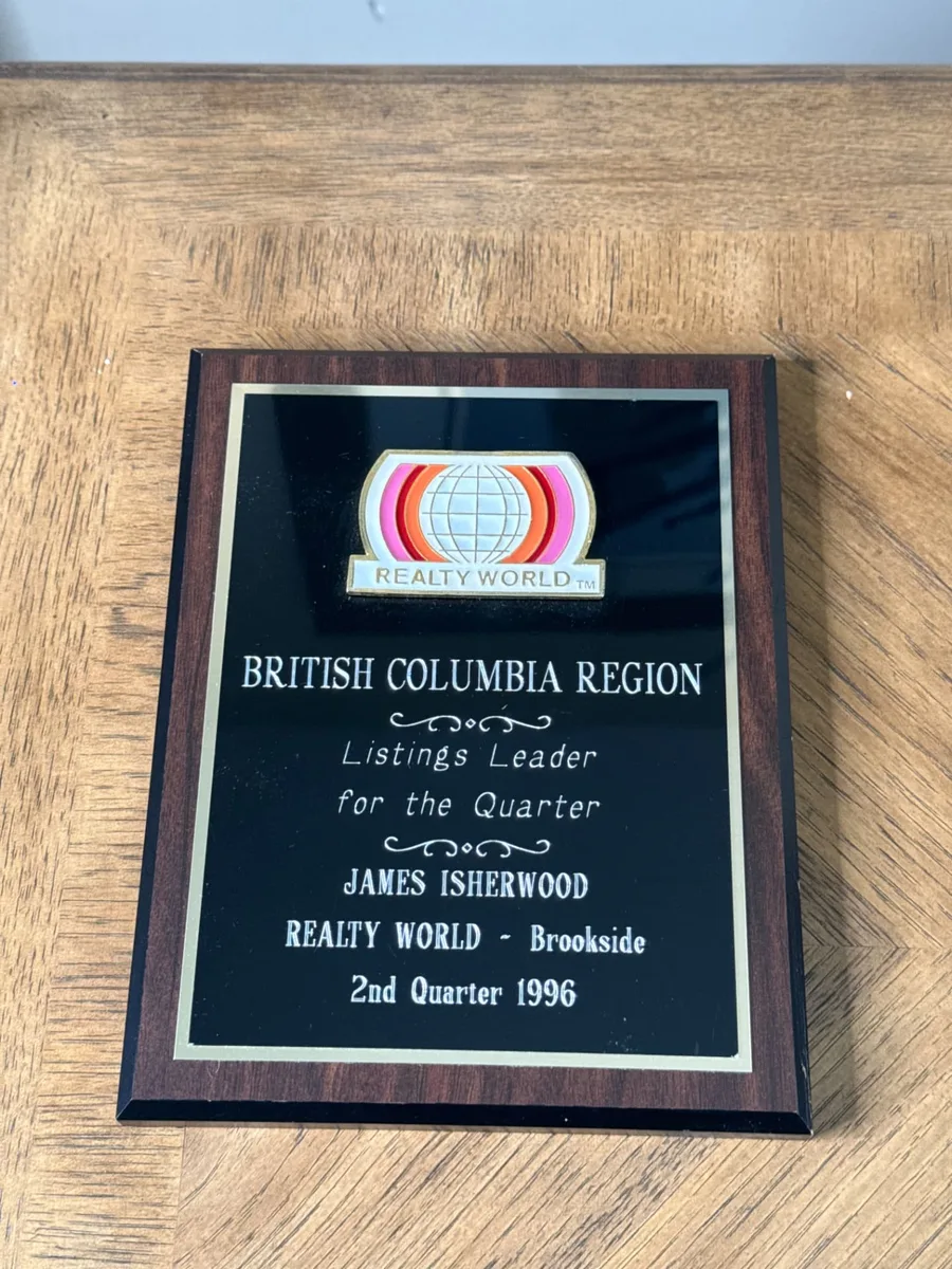 Realty World British Columbia Region Listings Leader for the Quarter plaque presented to James Isherwood, Realty World – Brookside, 2nd Quarter 1996
