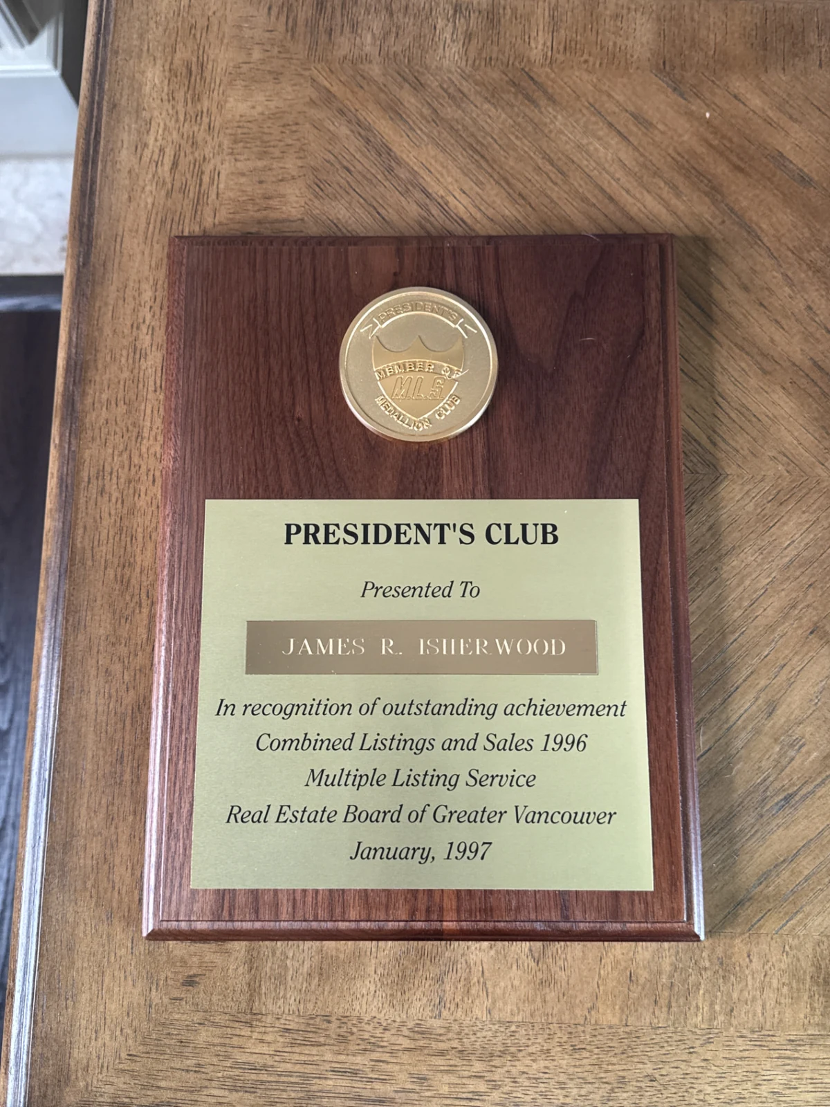 President’s Club plaque presented to James R. Isherwood by the Real Estate Board of Greater Vancouver for combined listings and sales in 1996, presented January 1997