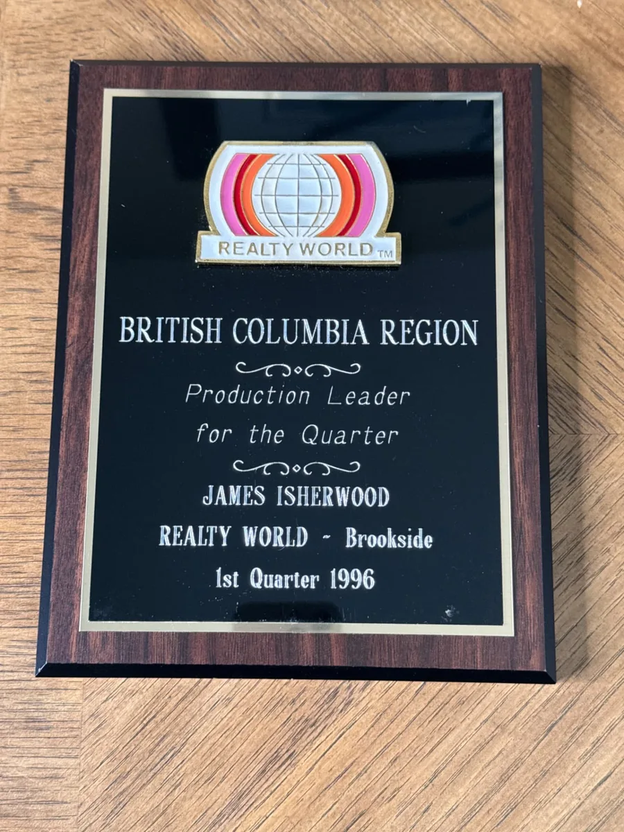 Realty World British Columbia Region Production Leader for the Quarter plaque presented to James Isherwood, Realty World – Brookside, 1st Quarter 1996
