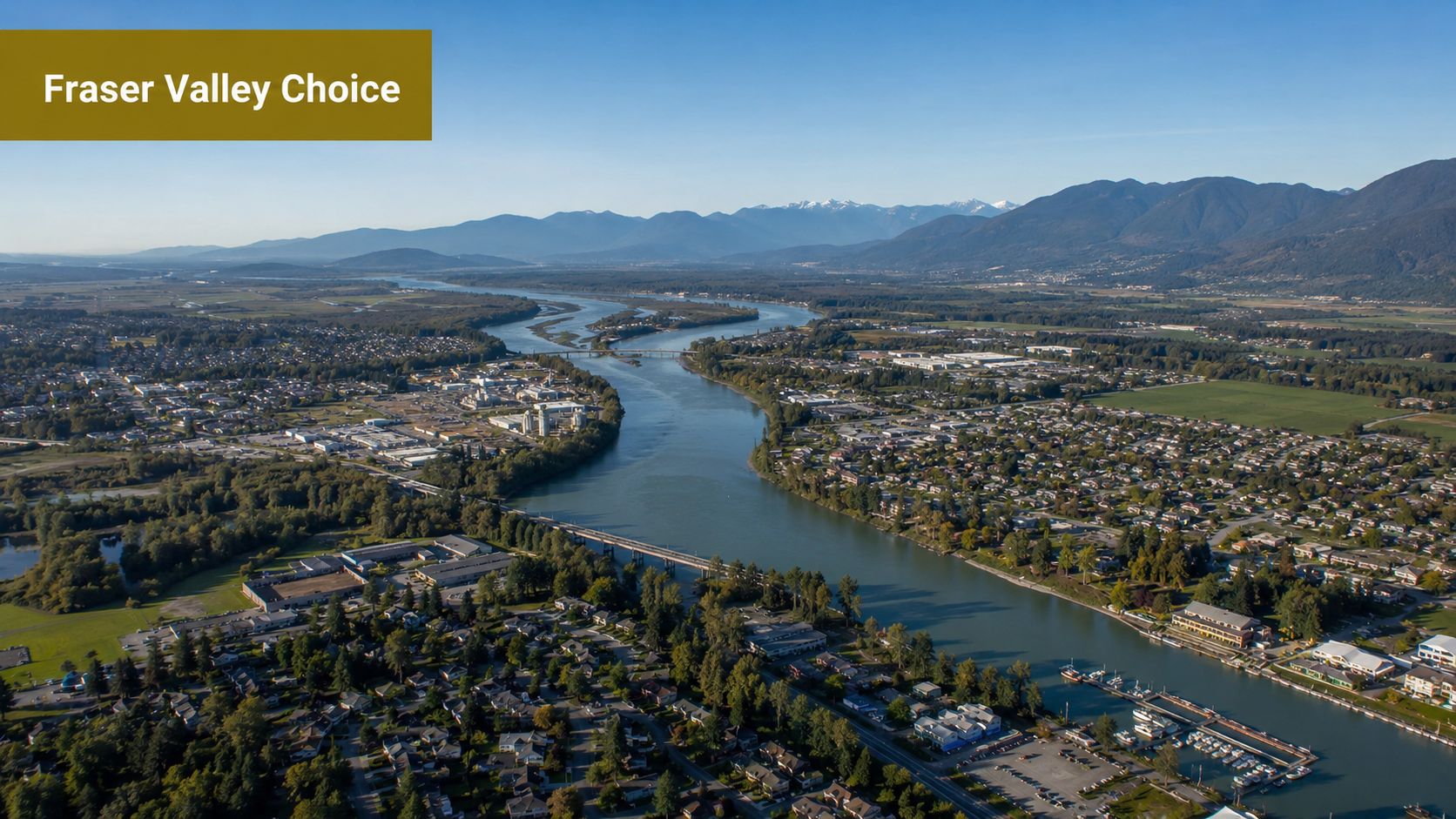 An aerial view of the Fraser River flowing through the scenic city of Maple Ridge and Pitt Meadows.