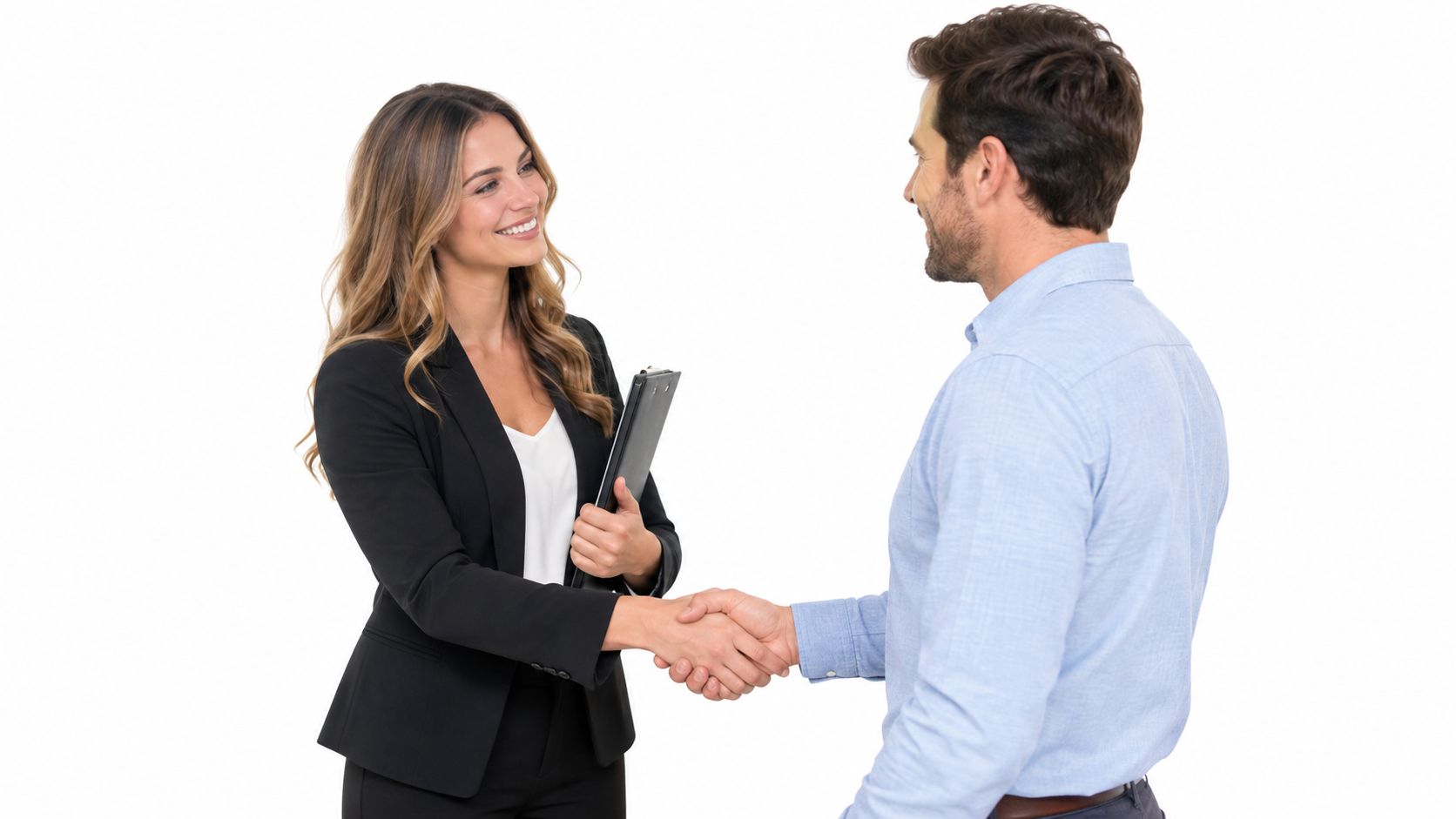A professional woman in a black suit shaking hands with a man in a blue shirt